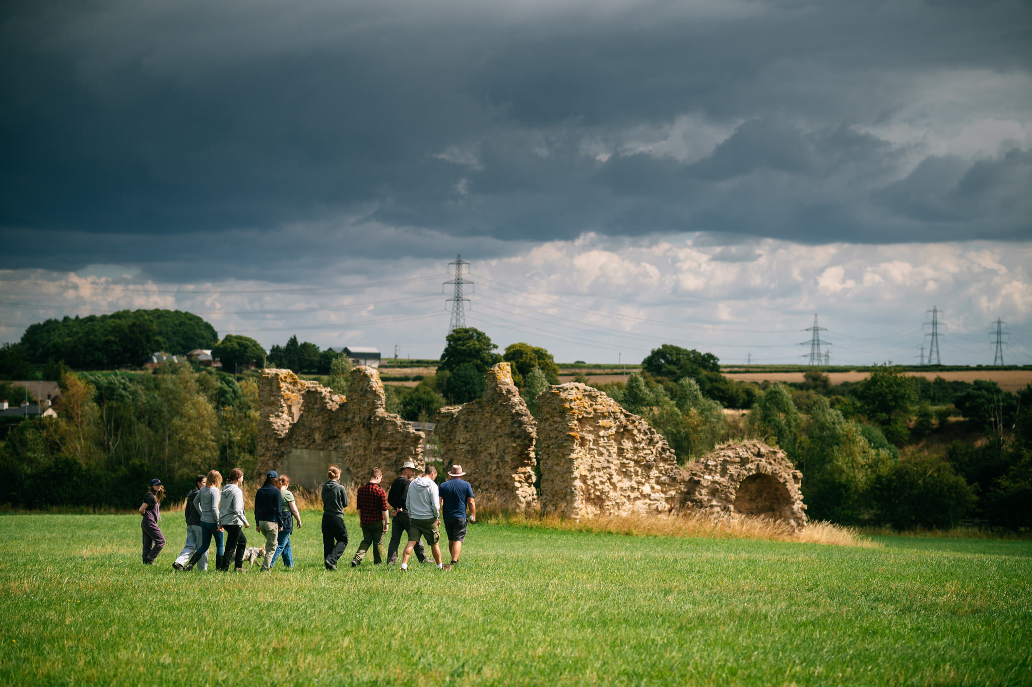 field school delegates being given a tour of the site