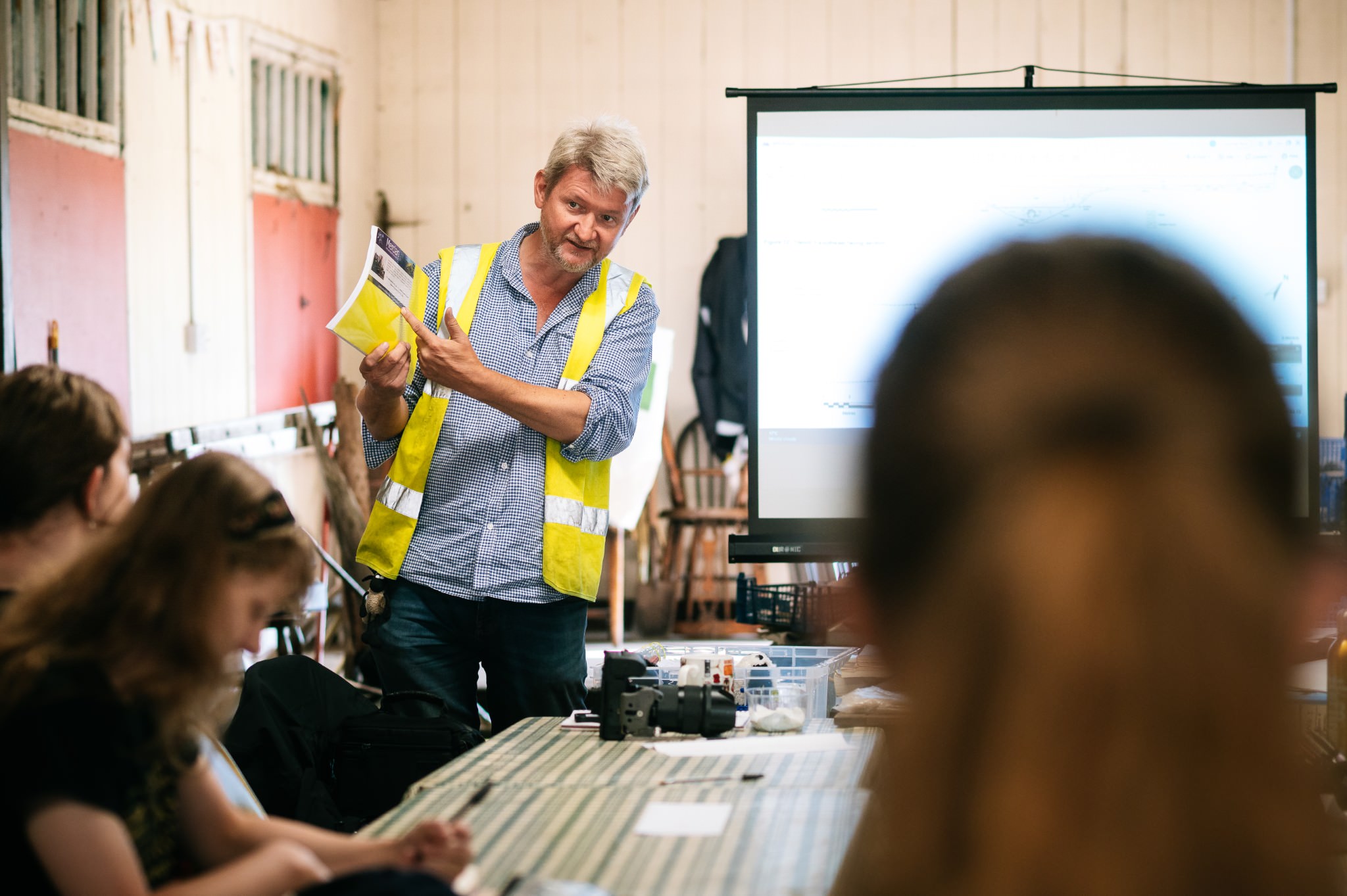 archaeologist giving a health and safety talk to the students